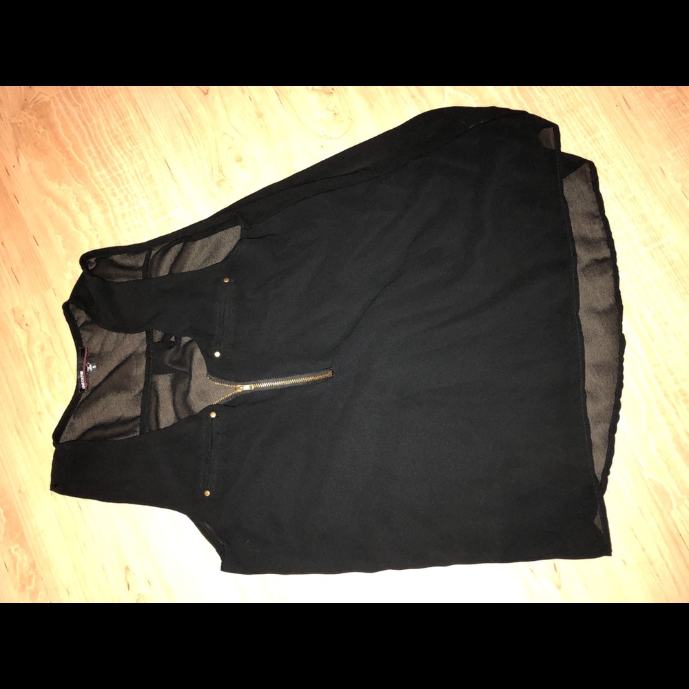 Woman’s sheer black top